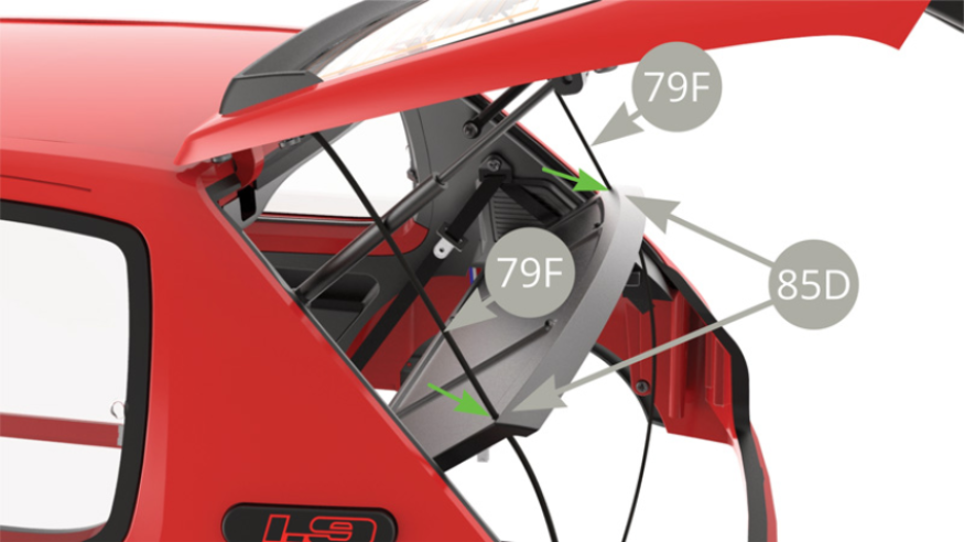 Pass 79F Parcel tray support cords through the openings at rear edge of 85D Parcel tray