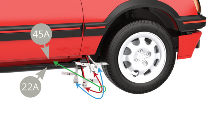 Connect the E (grey - white) and K (black - red) cables together near the right front wheel. Then slide them into the slot on the bottom side between the passenger compartment floor 45A and the chassis panel 22A.