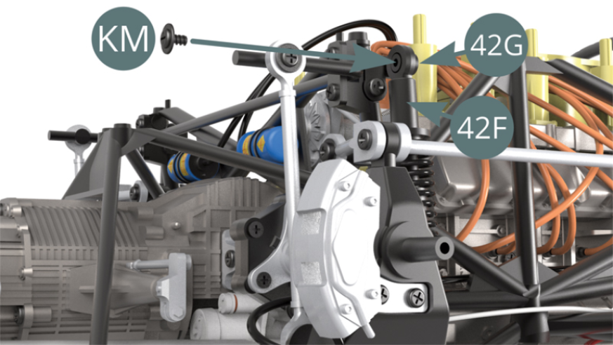 Positionner la tête du piston de suspension 42F sur l’extrémité du support 42G et la fixer avec une vis KM.