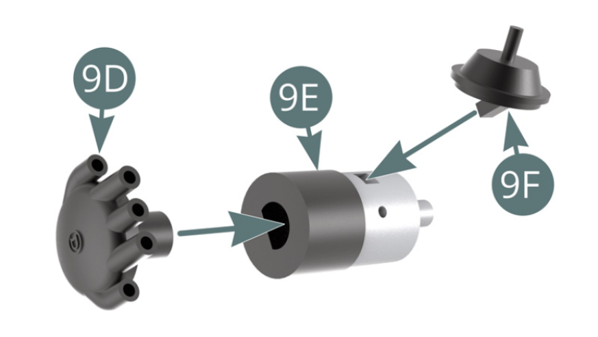 Position the distributor head (9D) and vacuum valve (9F) onto the ignition distributor (9E). Detach the five distributor terminals (9G) from the sprue.