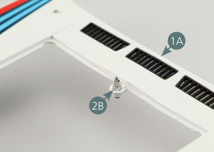 Pre-assembled front bonnet Align the apertures of the central lock (2B) parallel to the edge of the front bodywork (1A) - red dotted lines -, then place it in the intended recess and secure with an AP screw.