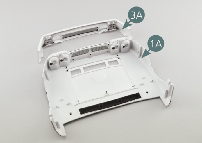 Place the front bumper (3A) on the front body (1A) using two SM and two CM screws.