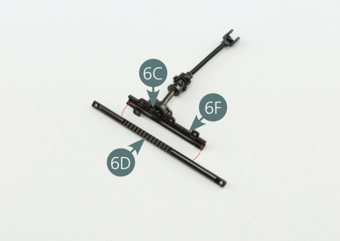 Place the steering rack (6D) into the rack half column (6F) making sure to place the steering pinion (6C) in the middle of the rack's toothed section - red circle.