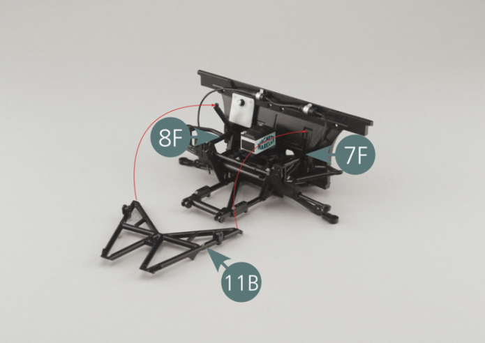 Position the inclined chassis frame (11B) on the lower frame (5A) and on the right (8F) and left (7F) side frames, then secure it with four AM screws.