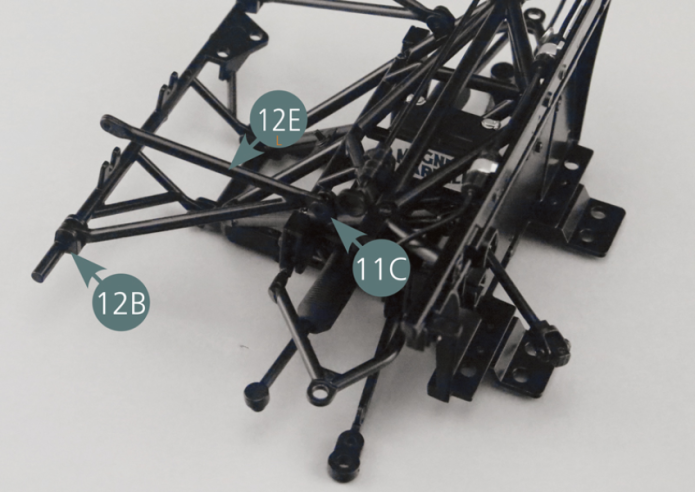 Position the left vertical tubular frame (12E) on the bracket (11C) and the lower bar (12B), then secure it with one EM screw and one GM screw respectively.