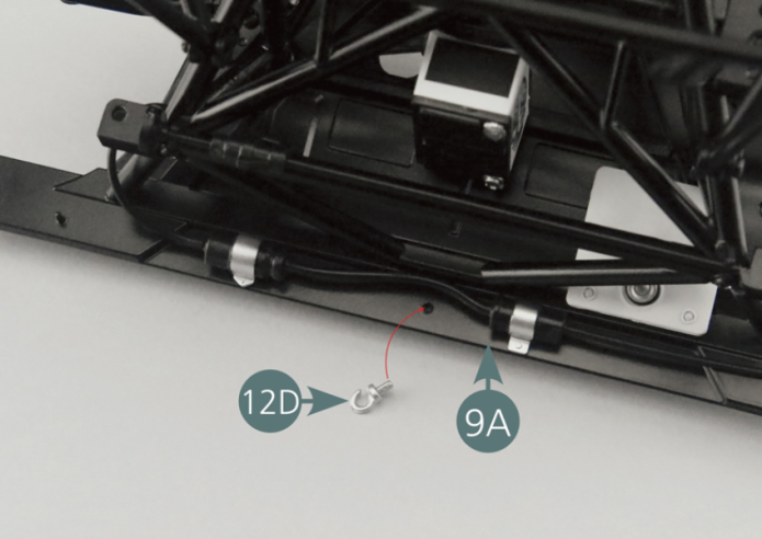 Place one of the hooks (12D) into the firewall (9A), with the open end facing upwards (illustration below: red circle).