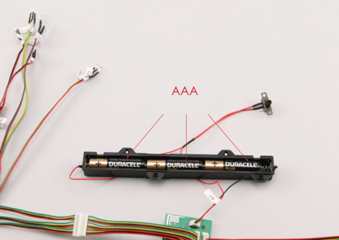 Place three AAA batteries in the battery compartment (18B) - batteries not included. Set the switch to the "ON" position.