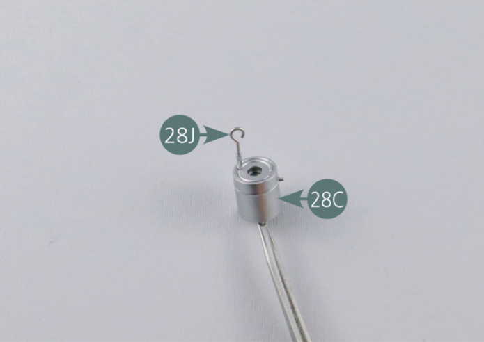 Position the oil dipstick (28J) on the oil tank (28C #3). Position the filler neck (28D #4) on the oil tank (28C #3). Secure the two elements together with an AP screw from below.