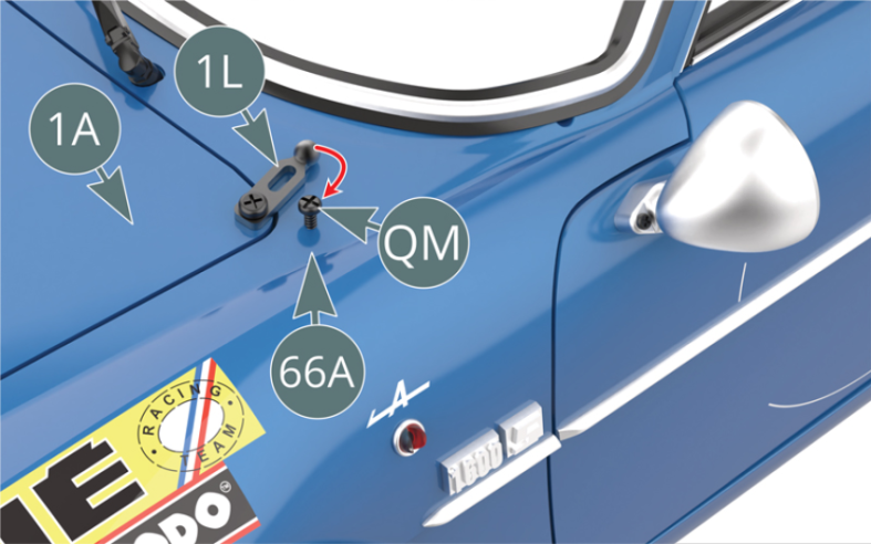 Insérer à moitié une vis QM sur l’aile avant gauche de la carrosserie 66A.Accrocher la serrure de capot 1L sur la tête de la vis QM.