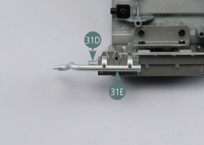 Position oil lines #1 (31E) and #2 (31F) onto oil pump (31G).