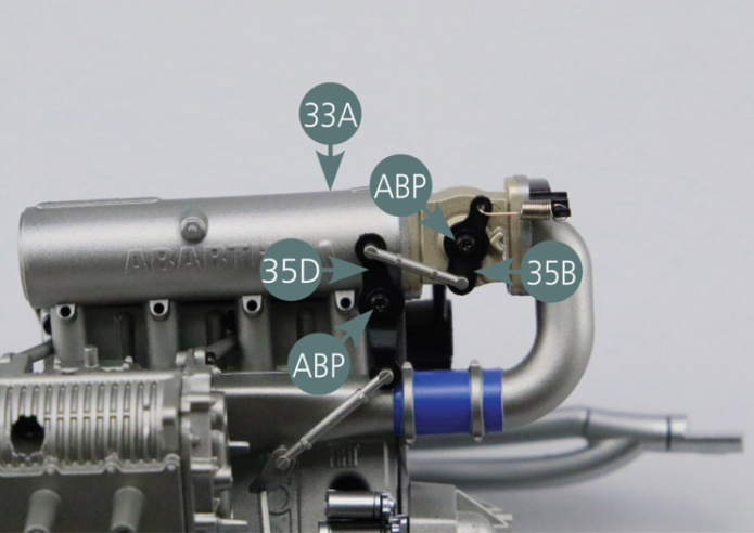 Secure the upper accelerator lever (35B) and centre rod (35D) to the intake manifold (33A) with two ABP screws - as shown in the picture.