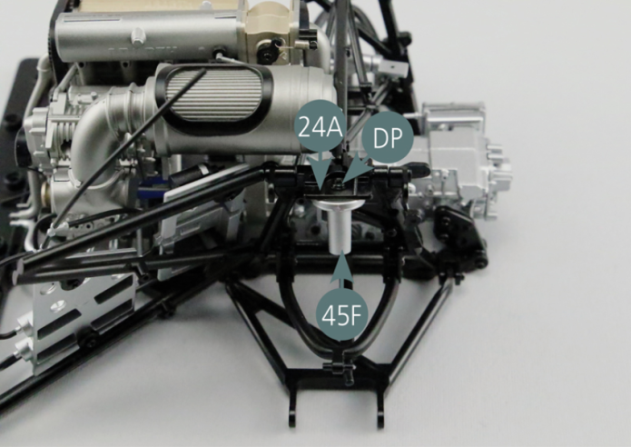 Position the upper rear suspension spring bracket (45F) beneath the left rear link arm (24A) and secure with a DP screw.