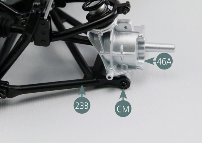 Secure the right rear hub (46A) to the right rear lower suspension arm (23B) using two CM screws.