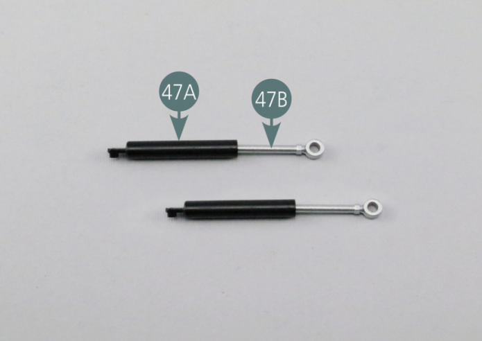 Introduce a spring (47D) and then a shock piston (47B) into a shock cylinder (47A). Assemble the second shock cylinder in the same way.