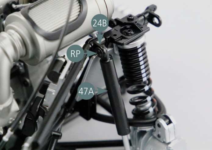 Position a shock absorber on the left side of the engine cradle. Secure the upper end of the shock absorber cylinder (47A) to the link arm bracket #1 (24B) using a RP screw. Then attach the lower end of the shock absorber piston (47B) to the left rear hub (45A) using a UM screw.