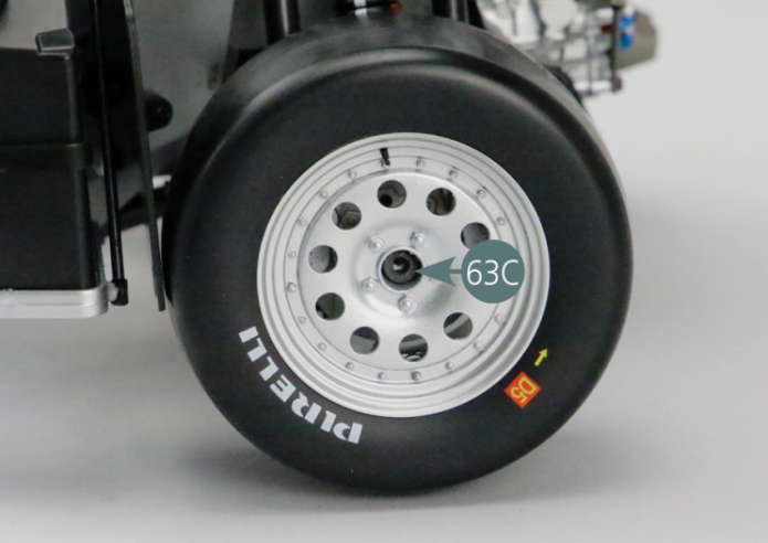 Place the rear wheel on the left rear hub (45A) making sure to engage the notch as indicated in the photo (red arrow). Position washer (63C) into the center of the outer wheel rim (61B). Secure the rear wheel to the left rear hub (45A) with a VM screw.