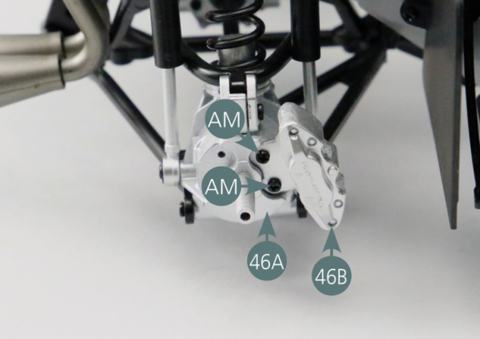 Position the brake caliper (46B) on the right rear hub (46A) and secure it with two AM screws. Position the brake disc on the right rear hub (46A).