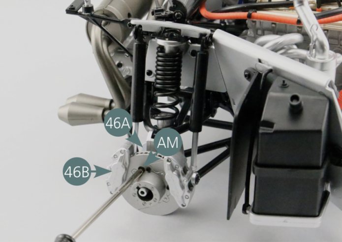 Place the second brake caliper (46B) on the right rear hub (46A). Insert an AM screw through the brake disc and screw it into one of the two mounting points of the caliper (46B). Rotate the brake disc until you find the other caliper mounting point, then insert another AM screw to secure the caliper (46B) to the right rear hub (46A).