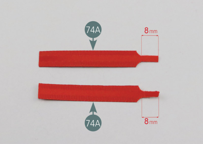 Cut the ends of the center seat belt straps (74A) as shown in the photo. If necessary, use a lighter to prevent the cut ends from fraying. Place four pieces of double-sided tape (74G) on the ends of the center seat belt straps (74A).