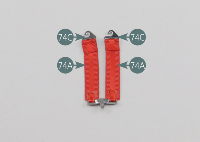 Place the center seat belt attachment hooks (74C) onto the center seat belt straps (74A). Make sure the hooks are correctly aligned. Turn the straps over (74A). Remove the protective film from the double-sided adhesives (74G) and bend the ends/tips of the straps to hold the attachment hooks.