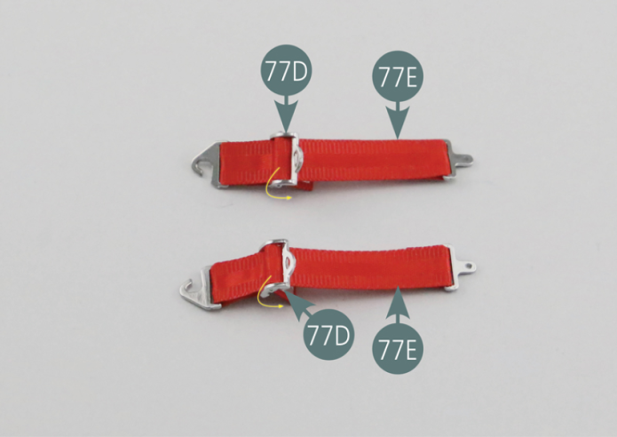 Engage the other ends of the long seat belt straps (77E) into the belt tensioners (77D) as shown in the picture. 