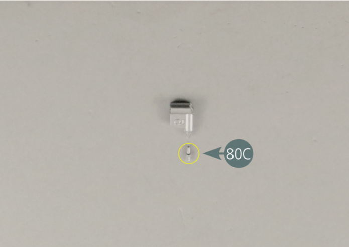 Detach the switch (80C) from the sprue, then position it in the recess next to the rectangular opening on the dashboard panel. 