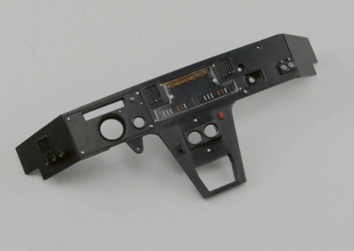 Hold the dashboard panel (80A) with the inside side facing up. Position the two fasteners (82B) near the top edge as shown in the photo and secure with two AP screws.