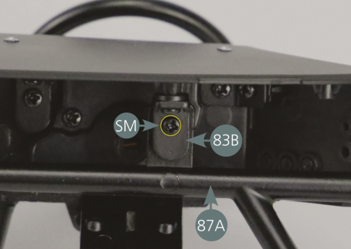 Place the support bar (87A) on the rear of the dashboard panel (80A). Match the openings of the bar (87A) with the fasteners (83B), then secure with two SM screws as shown in the photos (yellow circles).