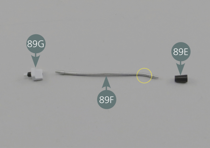 Assemble elements 89E, 89F and 89G - forming together the passenger’s reading light - as indicated by the yellow arrows. Check that the curved part of the arm (89F) is correctly placed towards the light (89E).