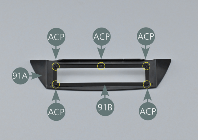 Place the rear window (91B) on the rear panel (91A) and secure with five ACP screws.