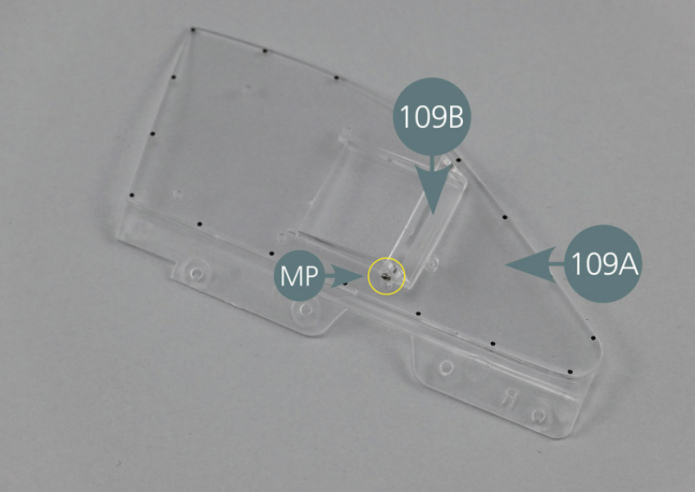 Position the deflector (109B) on the outside of the window (109A) and secure it with two MP screws as shown.