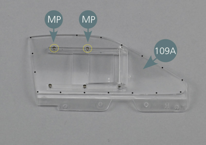 Position the upper window guide (109D) on the inside of the window (109A) ensuring that the groove is facing downwards as per picture. Center the pin located on the right of the window into the opening of the upper window guide as shown (yellow circle). While holding the guide and the window in position, secure the guide (109D) from the outside of the window (109A) with two MP screws.