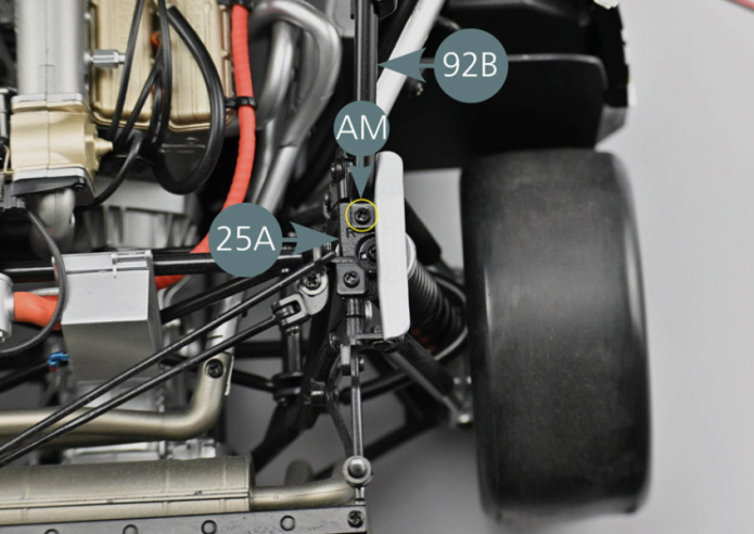 Turn the assembly over and attach the left and right rear upper reinforcement  bars (92A&92B) to the engine frame (rear trapezoidal link arm 24A&25A) with two AM screws as shown (yellow circles).