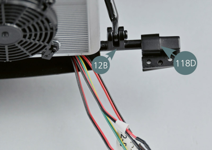 Position the left hinge (118D) and the right hinge (118E) at opposite ends of the lower bar (12B).