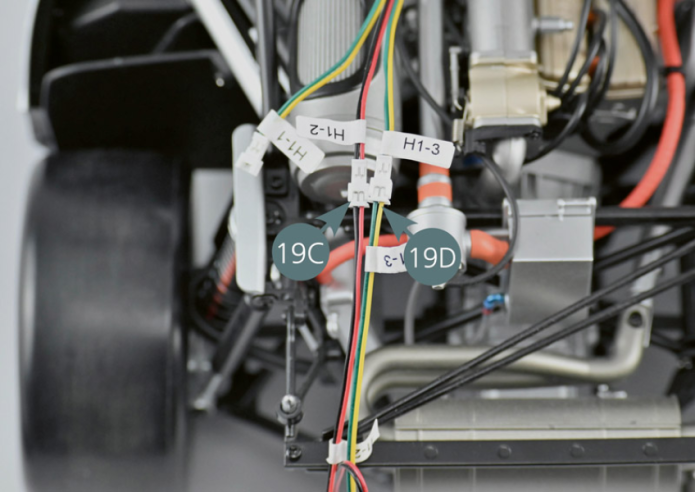 Disconnect cables H1-2 (19C) and H1-3 (19D) from the vehicle wiring harness. Also disconnect cable H1-4 (19E).