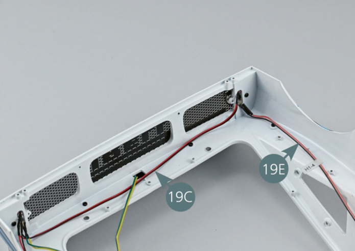 The H1-2 cable (19C) includes two LEDs. Insert the first LED into the top opening (red) of the left rear light. Then insert the second LED into the top opening (red) of the right rear light. Insert the LED from cable H1-3 (19D) into the lower opening (orange) of the left rear light. Insert the LED from cable H1-4 (19E) into the lower opening (orange) of the right rear light.